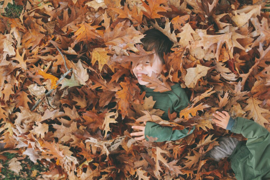 Some of the fun things to do as Fun Halloween Activities is to leaf pile dive!
